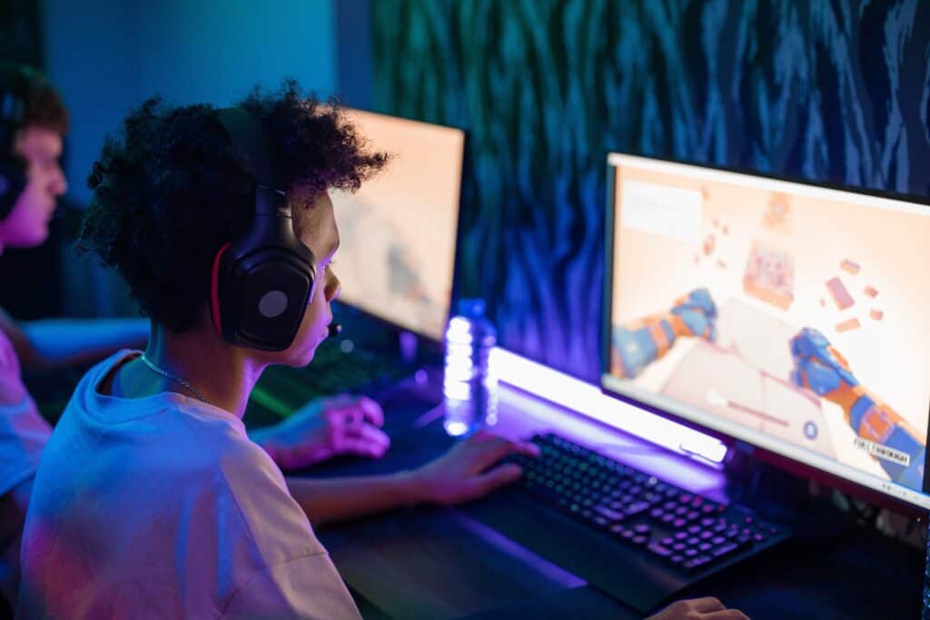 pexels-ron-lach-7848992 young man gaming with headphones on
