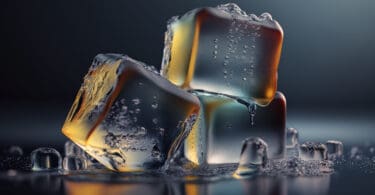 Melting Ice cubes with water drops on a table. Clear ice in cube shape. Frozen water. Ice maker. Fake or Artificial acrylic or plastic ice cubes, back lighting